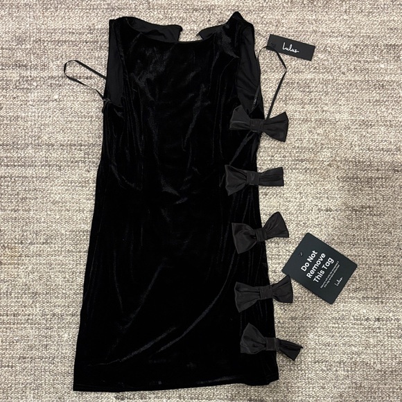 Lulus Dresses & Skirts - Lulu's Elegant Black Mini Dress with Bow Details
